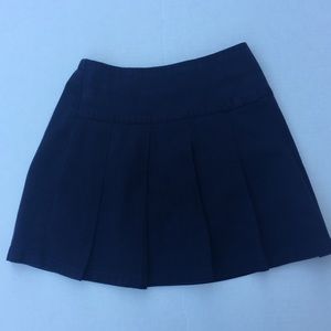 Navy blue girls uniform skort.